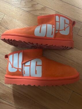 UGG Bright Orange Short Suede Slip-On Booties with White Logo